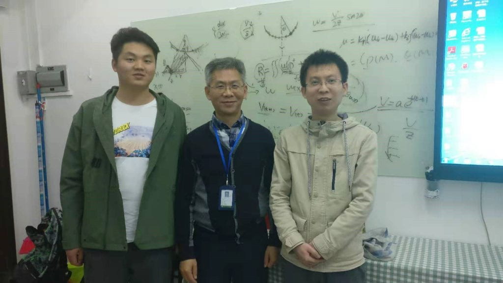 Fig. 2. Discussing with Professor Peng in his office